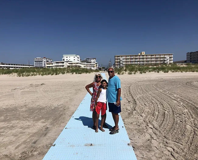 Family on a AccessRec Accessdeck USA Ground Accessibility & Mobility Mat