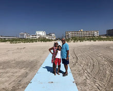 Load image into Gallery viewer, Family on a AccessRec Accessdeck USA Ground Accessibility & Mobility Mat