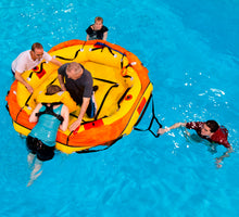Load image into Gallery viewer, Five people ready to board the Switlik Type II Coastal Passage Raft with Part 91 Kit