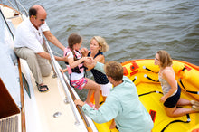 Load image into Gallery viewer, people ready to board the Switlik OPR Offshore Passage Raft