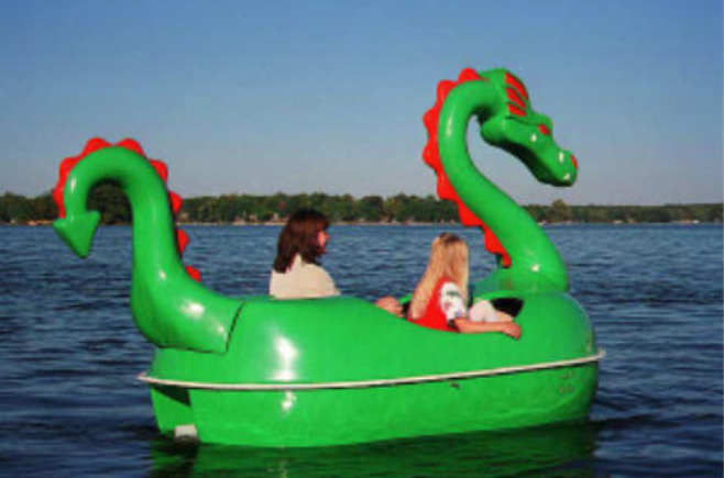 girls having fun riding the Adventure Glass Dragon Classic 2 Person Paddle Boat