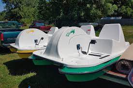 two Adventure Glass 4 Person Platform SeaVenture Paddle Boat ready for transport