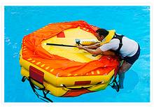 Load image into Gallery viewer, man trying to board on the Switlik OPR Offshore Passage Raft
