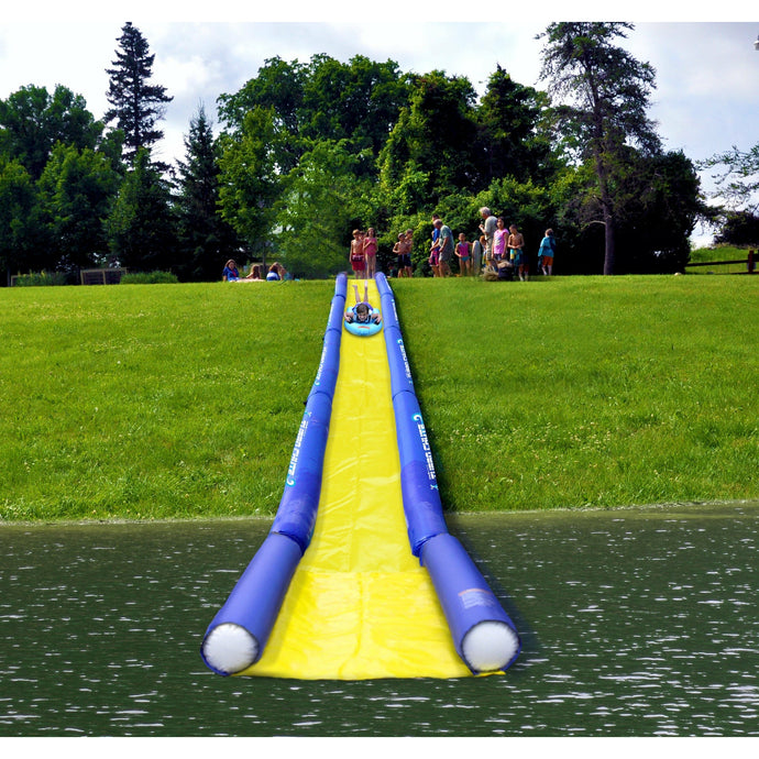 A kid riding at the Turbo Sled while sliding in the Rave 20' Turbo Chute Waterslide 