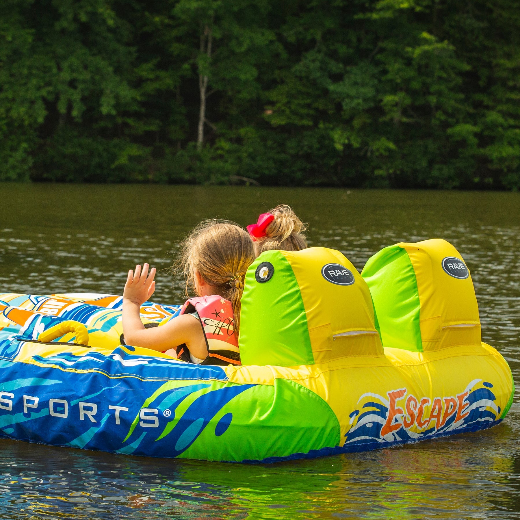Rave Escape Pontoon 2P Towable Tube being towed with 2 kids riding on it