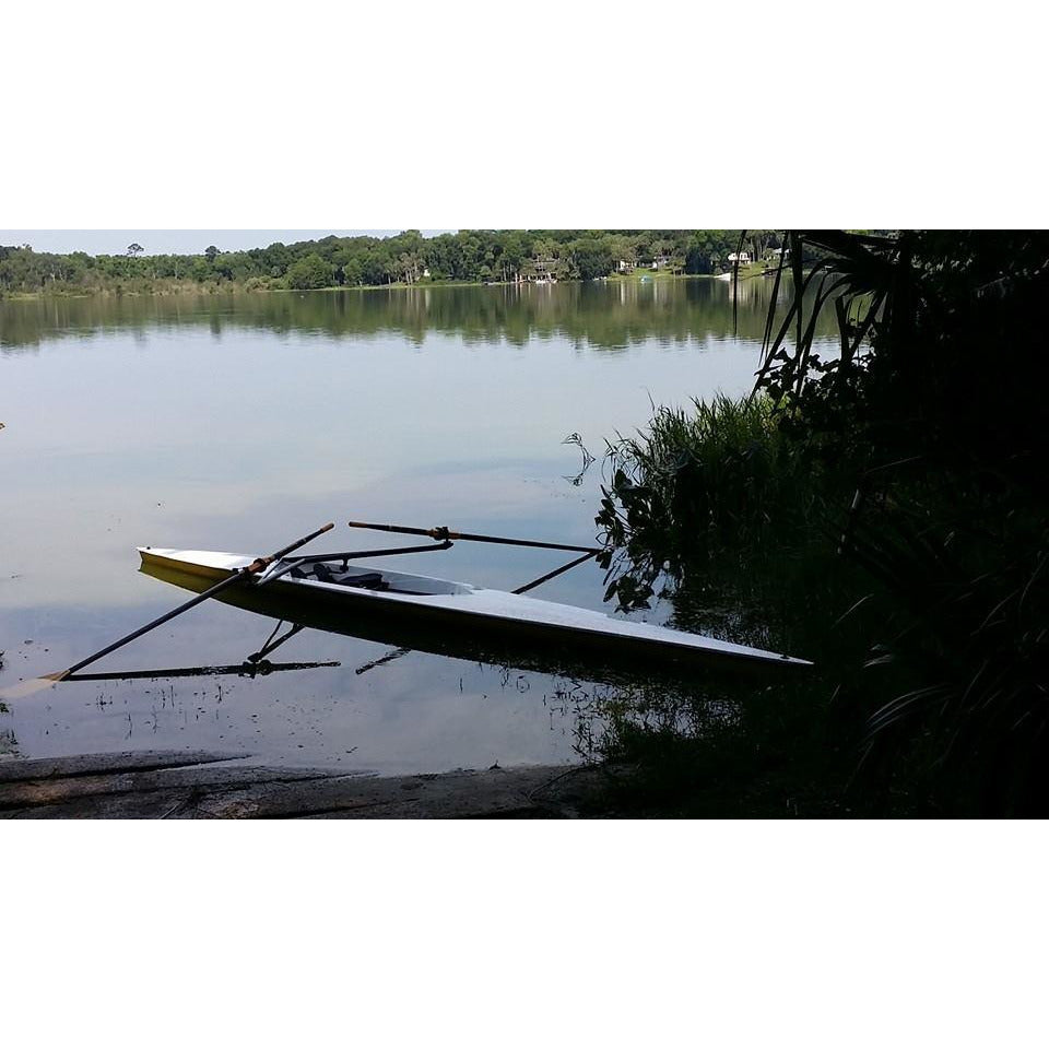 Boat - Little River Marine Regata Rowing Shell  resting at the side