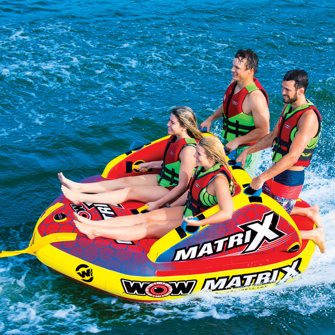 WOW Matrix 4P Towable Tube being towed with 2 women seating and 2 men kneeling at the back