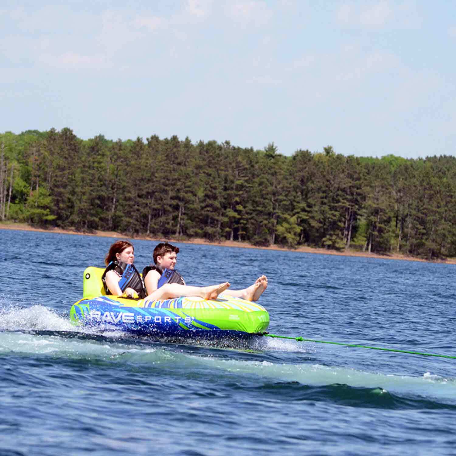 Rave Escape Pontoon 2P Towable Tube being towed with 2 people riding on it