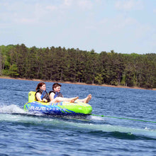 Load image into Gallery viewer, Rave Escape Pontoon 2P Towable Tube being towed with 2 people riding on it