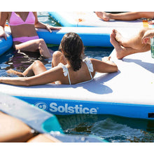 Load image into Gallery viewer, A girl sitting on Solstice Watersports 10' X 8' X 8" Inflatable Rec Mesh Dock 38180