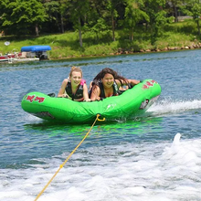 Load image into Gallery viewer, 2 woman riding Rave Sports Mambo 3 Rider Towable 02463
