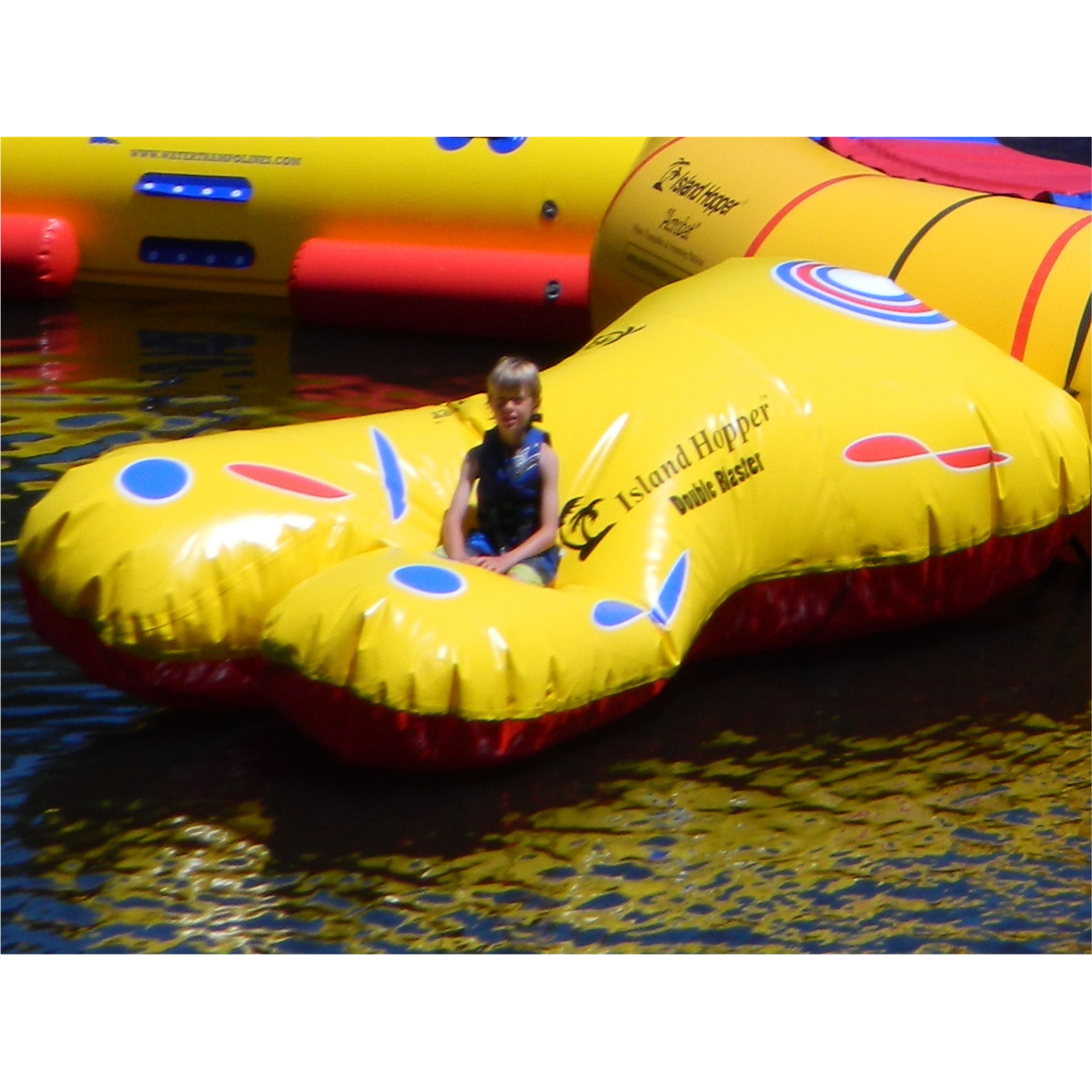 Kid riding in Island Hopper Double Blaster Attachment