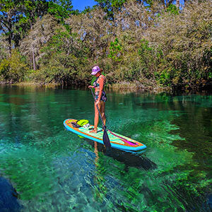 A girld standing on Pulse The Flamingo 10'6" Tradisional SUP