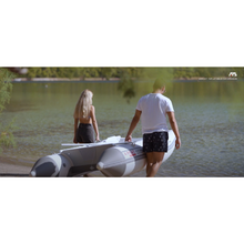 Load image into Gallery viewer, Boat - Man and Woman carrying the Aqua Marina The Aircat Catamaran BT-AC285