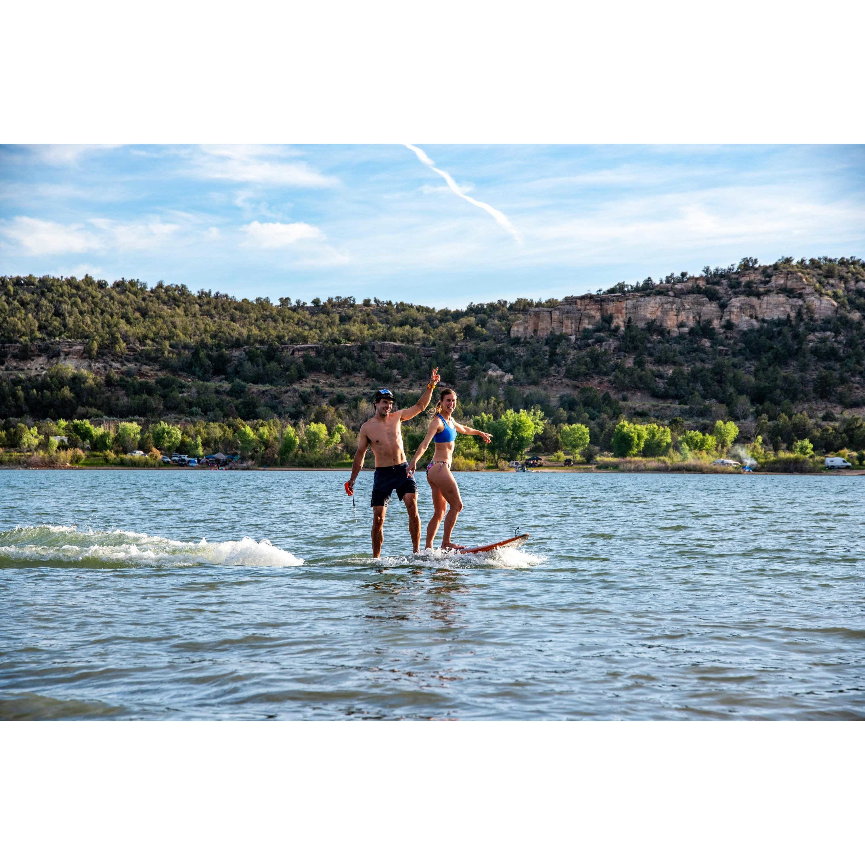Man and Woman riding Yujet Surfer Electric Jetboard EJB-01