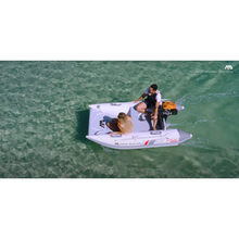 Load image into Gallery viewer, Boat - Man and Woman riding a Aqua Marina The Aircat Catamaran BT-AC335 with motor