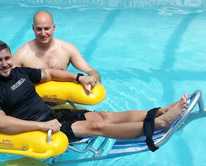 Two men in a pool with a Accessrec WaterWheels Floating Beach  Wheelchair