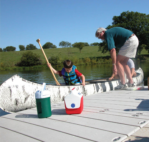 family docking their boat at the Connect-A-Dock Straight Shape High-Profile Docks