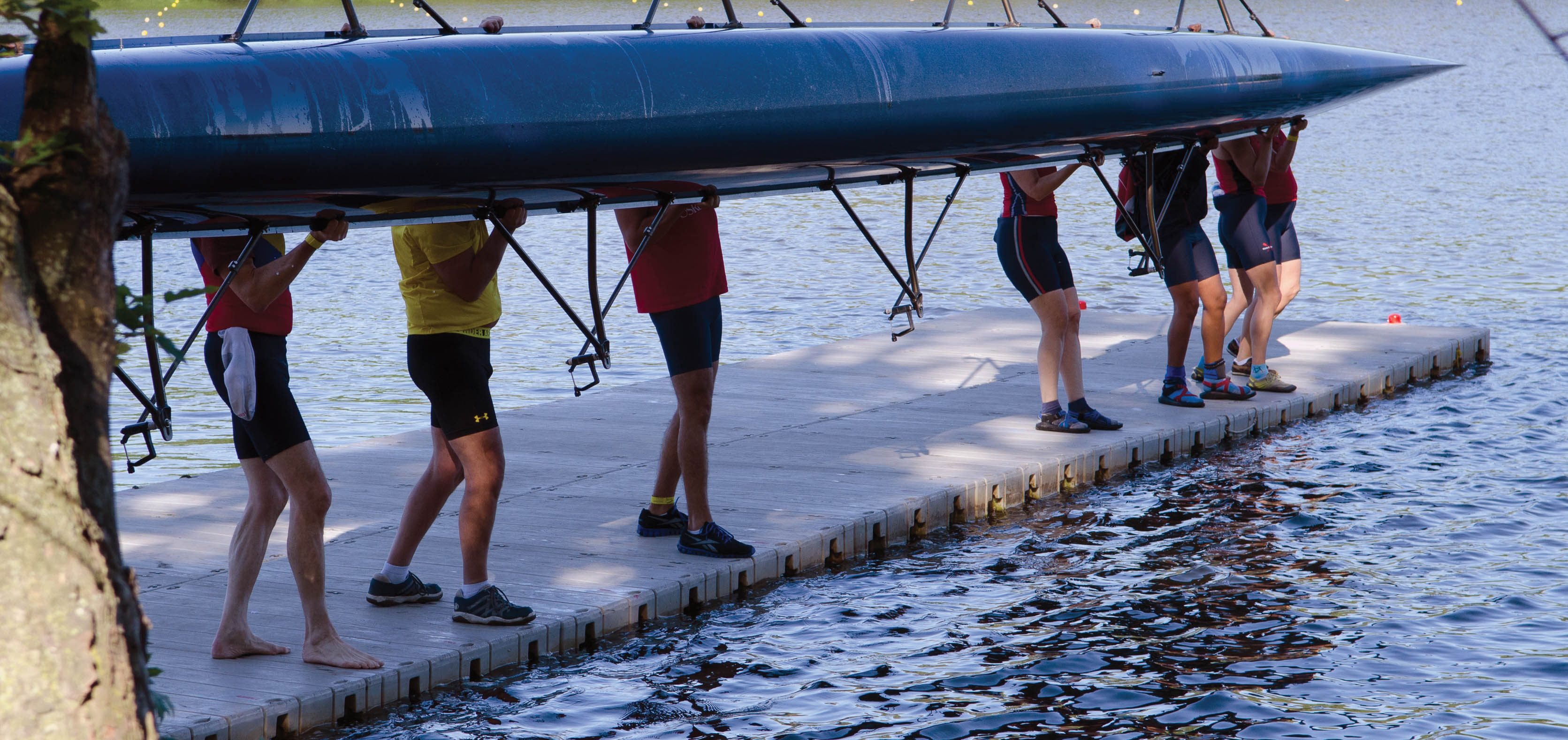 people carrying their rowing shell on the Connect-A-Dock Straight Shape High-Profile Docks