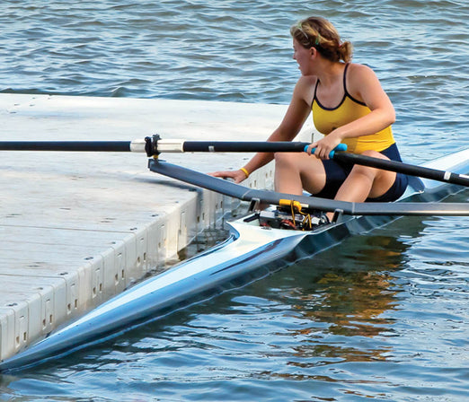 Woman docking her kayak at the side of Connect-A-Dock Straight Shape Low-Profile Docks