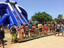 Load image into Gallery viewer, People falling in line to the Freestyle Slides Trippo Inflatable Water Slide