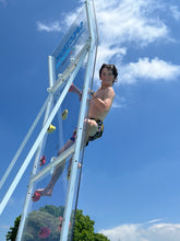 Load image into Gallery viewer, Young adult climbing the Spectrum Aquatics Kersplash Challenger Pool Climbing Wall