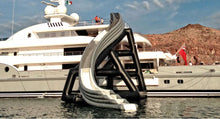 Load image into Gallery viewer, Freestyle Slides Cruiser Curved Slide set up at the side of the yacht