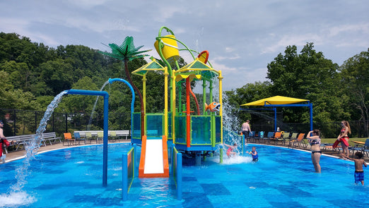 Families Enjoying a Rain Drop Molecule Structure Water Park