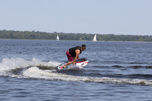Load image into Gallery viewer, Man enjoying the water with the SAVA All-New E1-B Electric Surfboard