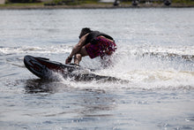 Load image into Gallery viewer, Man in action with the SAVA All-New E1-B Electric Surfboard