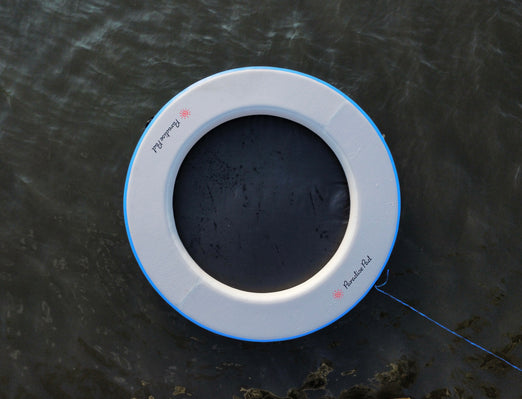 Paradise Pad 8' Round Splash Island Lake Pad on the water..