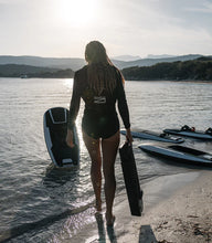 Load image into Gallery viewer, Woman carrying the Awake Flex Battery XR