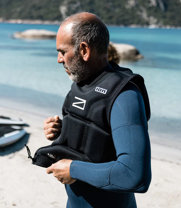 Man fixing his Awake x ION Impact Vest