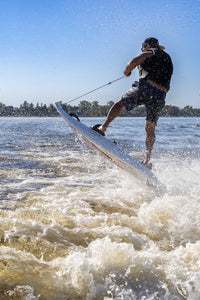 Man having fun on the water with the  SAVA All-New E1-B Electric Surfboard