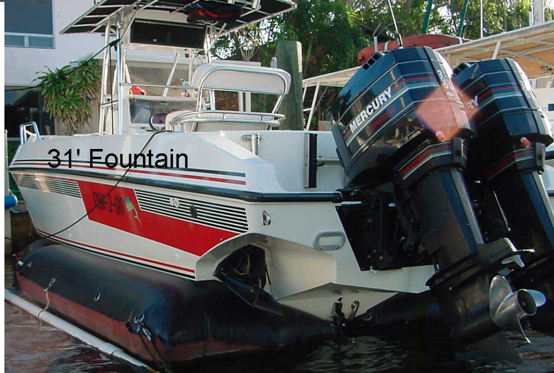 Center Console with Twin Mercs Sitting On An Airdock Boat Lift