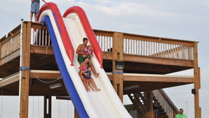 Family having fun at the Freestyle Slides Dock Slide Inflatable Water Slide