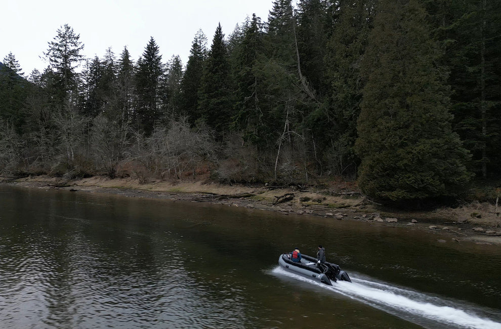 Men riding the Swellfish FS Jet 500 XL Tunnel Foldable Inflatable Boat