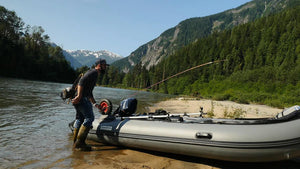 Man ready to go fishing with the Swellfish Classic 350 Inflatable Boat (11'6")