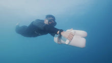 Load image into Gallery viewer, Man with the Sublue Hagul EZ Underwater Scooter enjoying underwater
