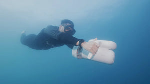 Man with the Sublue Hagul EZ Underwater Scooter enjoying underwater
