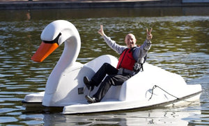 Man riding the Adventure Glass Swan Platform 2 Person Paddle Boat