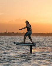 Load image into Gallery viewer, Man riding the Awake Vinga 3 Electric Surfboard EFoil