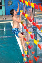 Load image into Gallery viewer, a boy climbing the Spectrum Aquatics Kersplash Challenger Pool Climbing Wall crystal at the side of the pool