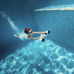 Boy having fun underwater with the Sublue WhiteShark MixPro Underwater Scooter