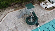 Load image into Gallery viewer, Spectrum Aquatics Single 360 Closed Flume, 8&#39; 2&quot; beside an outdoor pool.