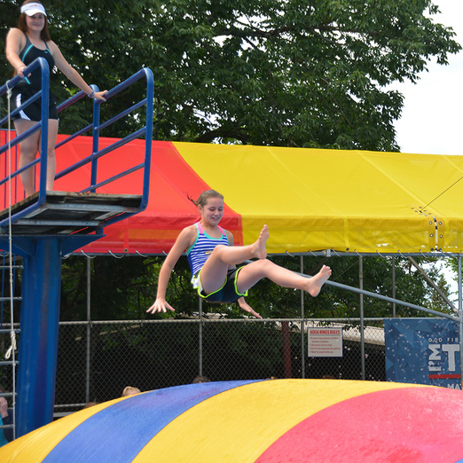 A girl jumping in the WaterBlob® Classic Blob®