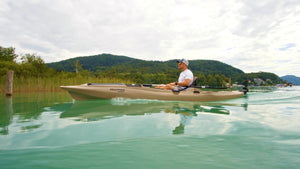 Man board on a kayak with the ScubaJet PRO Kayak Kit
