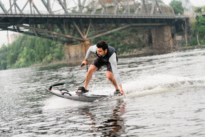 Man riding the SAVA All-New E1-B Electric Surfboard