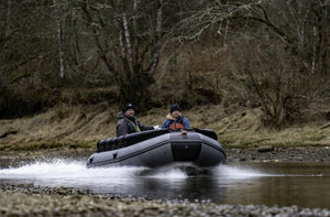 Man riding the Swellfish FS Jet 400 Tunnel Foldable Inflatable Boat passing on a very shallow water