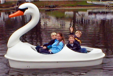 Load image into Gallery viewer, four people having fun in the Adventure Glass Swan Classic 4 Person Paddle Boat